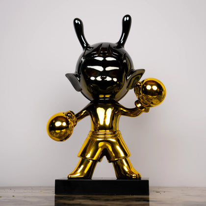 pop art cartoon figurine in chrome gold finish for modern home decor