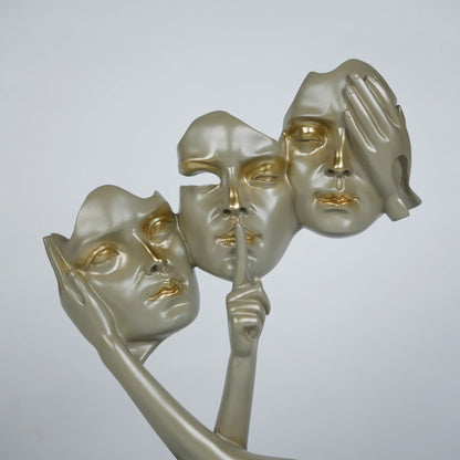 Gold abstract triple-face sculpture on black base