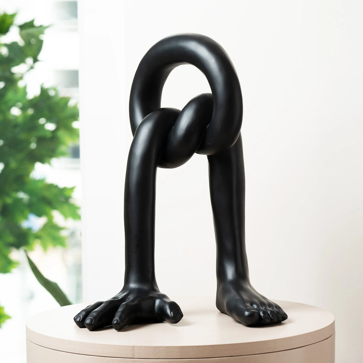 Interwoven Balance on round wood pedestal
