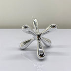 Abstract chrome decor objects designed for elegant shelf, console and coffee table styling