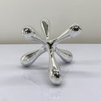 Artistic chrome decor objects with abstract contemporary design for elegant modern interiors