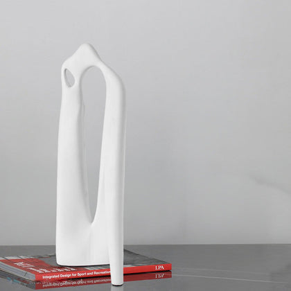 Textured white abstract loop decor accent displayed on modern surface