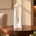 Textured white abstract loop decor accent displayed on modern surface