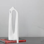 Textured white abstract loop decor accent displayed on modern surface