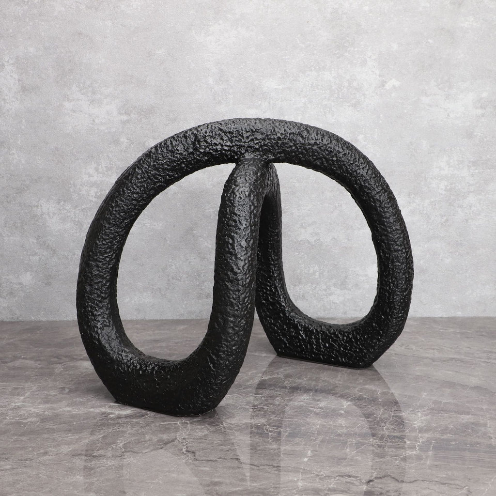 Black infinity loop decor with textured matte finish for modern interiors
