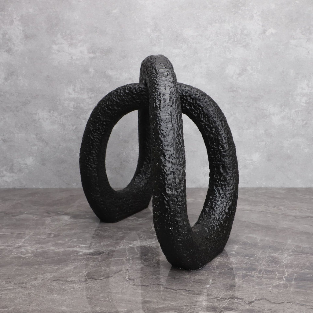 Black infinity loop decor with textured matte finish for modern interiors