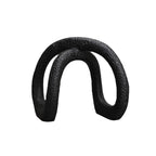 Black infinity loop decor with textured matte finish for modern interiors