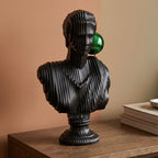 Matte black modern bust sculpture featuring an abstract human face design for luxury contemporary home décor