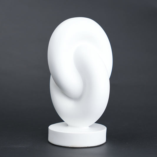Infinity curve decor in matte white with smooth loop design for modern home styling