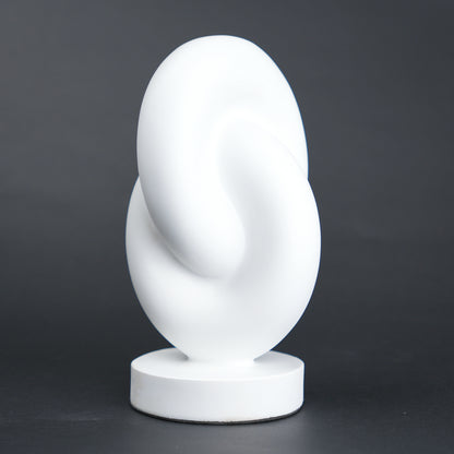 Infinity curve decor in matte white with smooth loop design for modern home styling