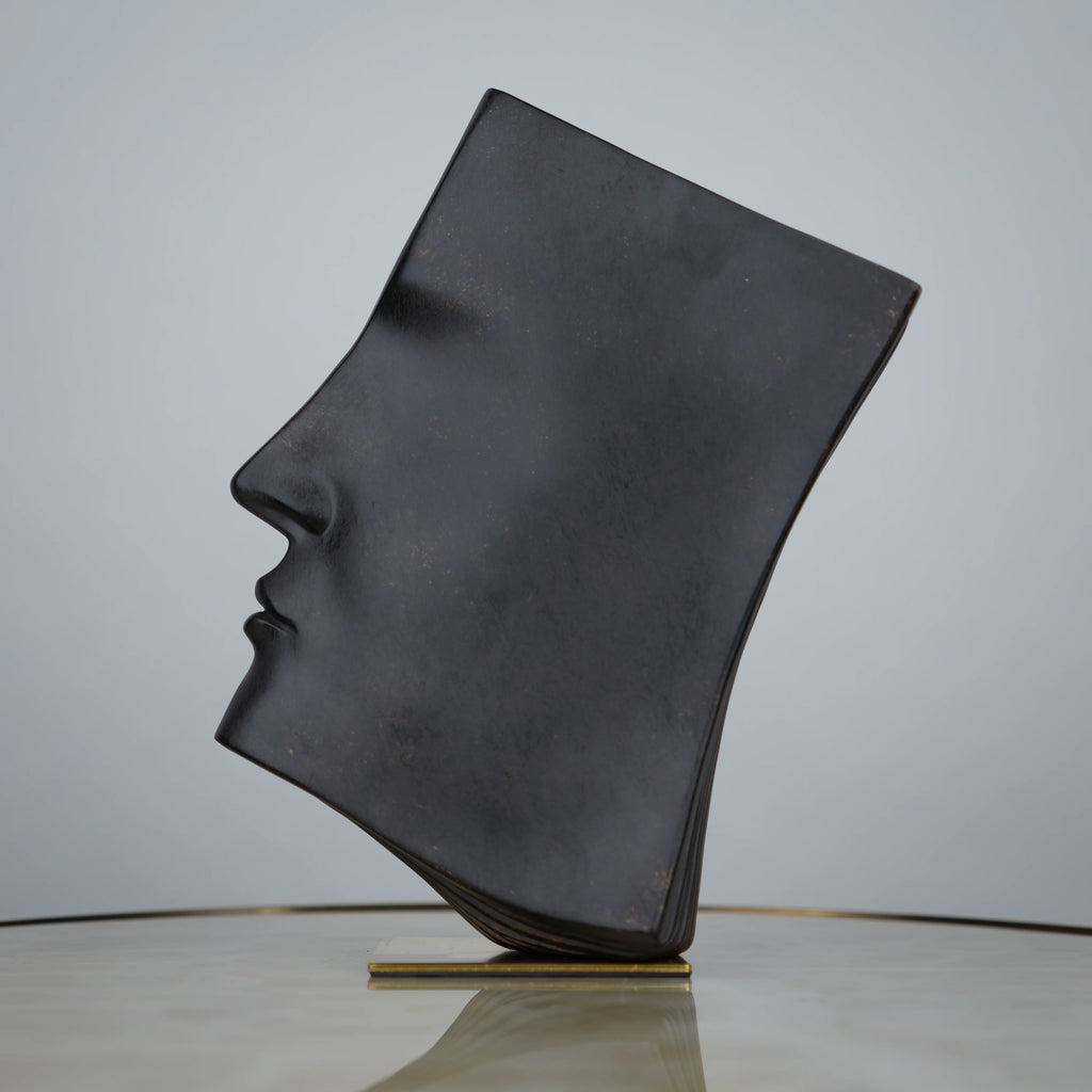 Contemporary artistic face decor for coffee table and shelf styling