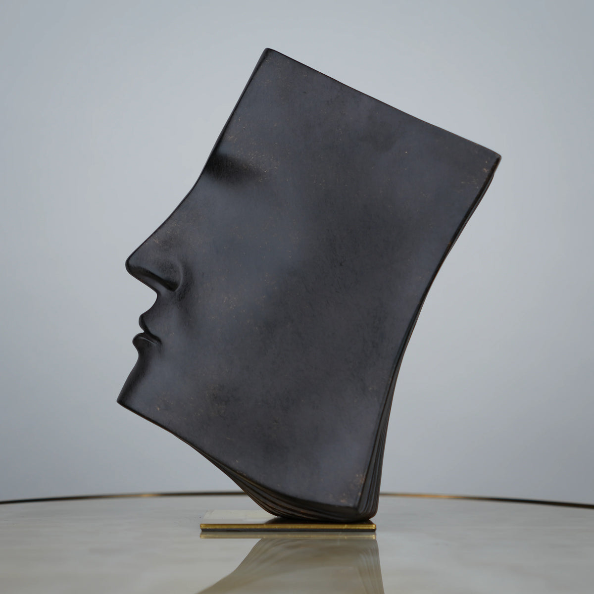 Contemporary artistic face decor for coffee table and shelf styling