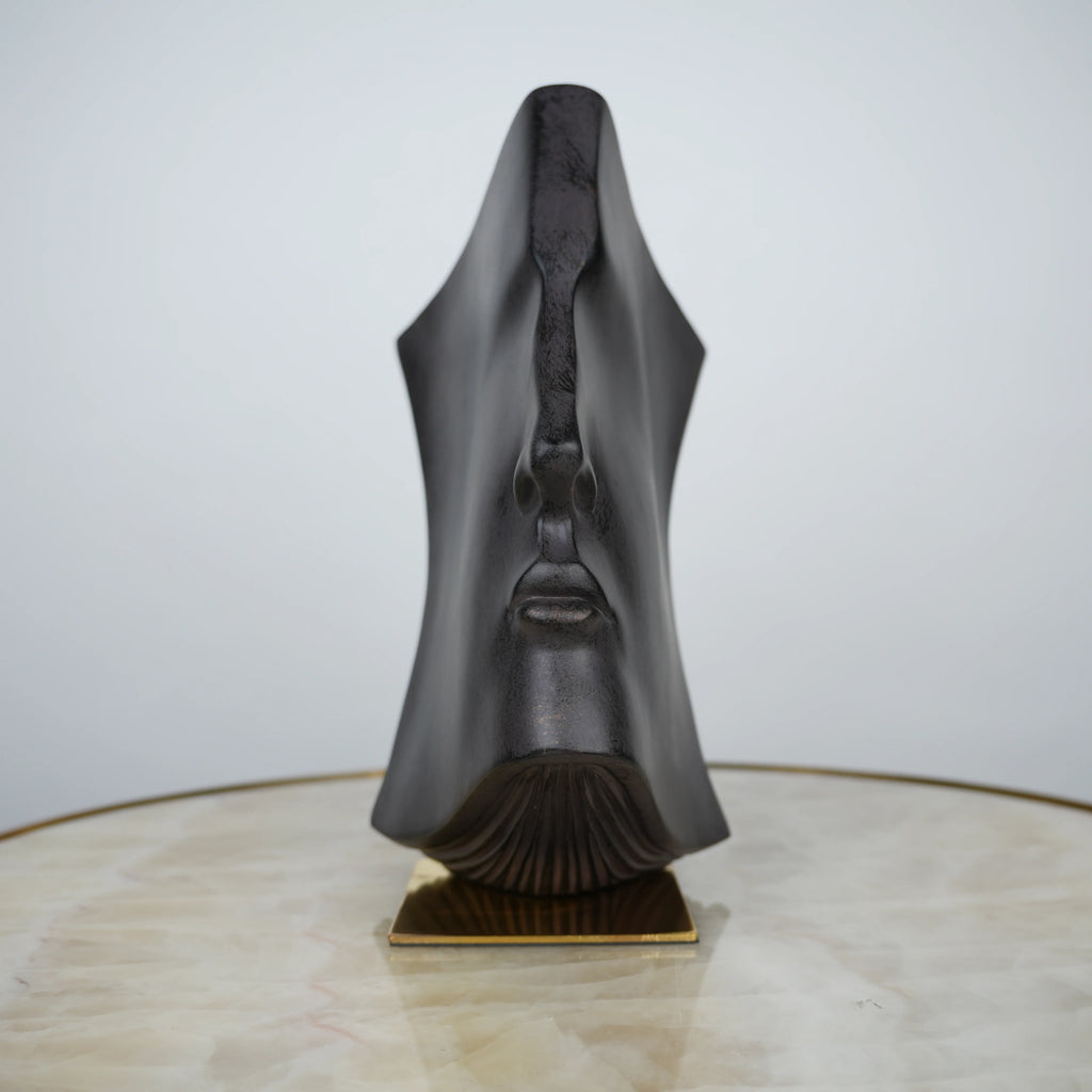 Contemporary artistic face decor for coffee table and shelf styling