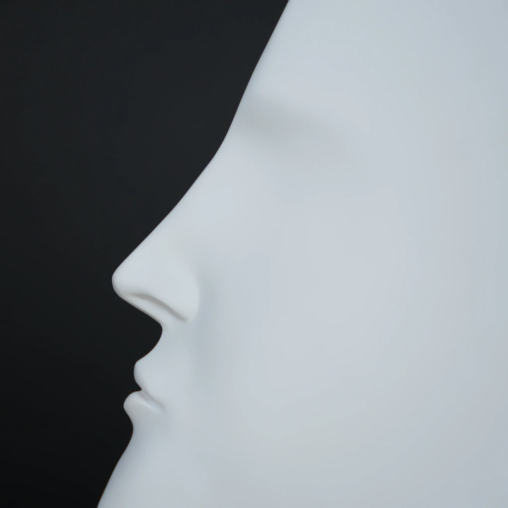 Abstract face decor piece in matte white finish, modern human form tabletop accent for living room, shelf or console styling