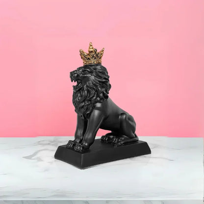 A matte black resin lion sculpture with a golden crown
