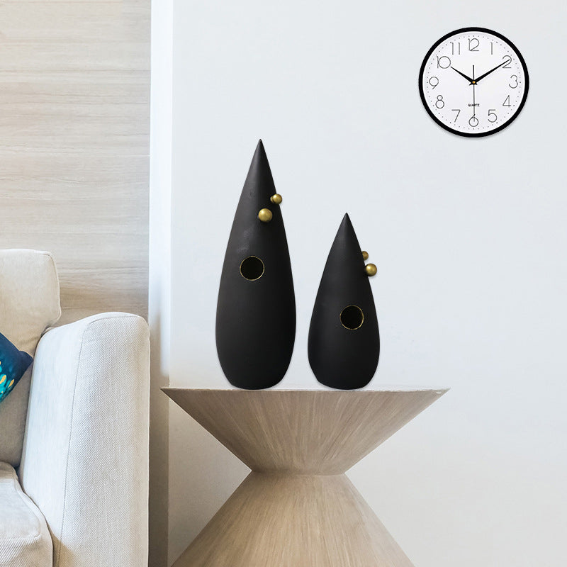 Abstract black decorative accent with gold detailing for modern shelf and console styling