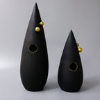 Abstract black decorative accent featuring gold details for contemporary home decor styling