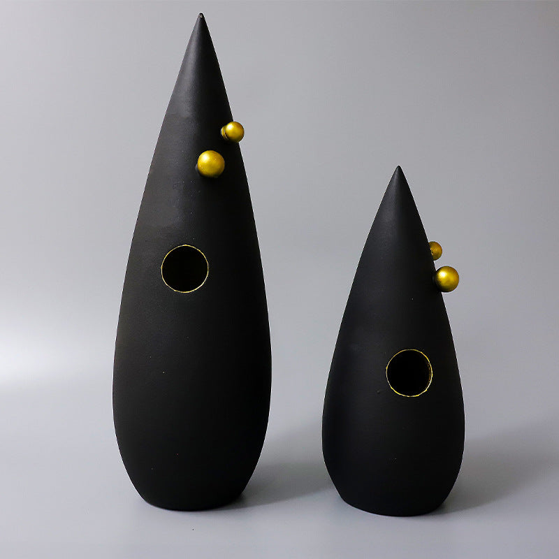 Abstract black decorative accent featuring gold details for contemporary home decor styling