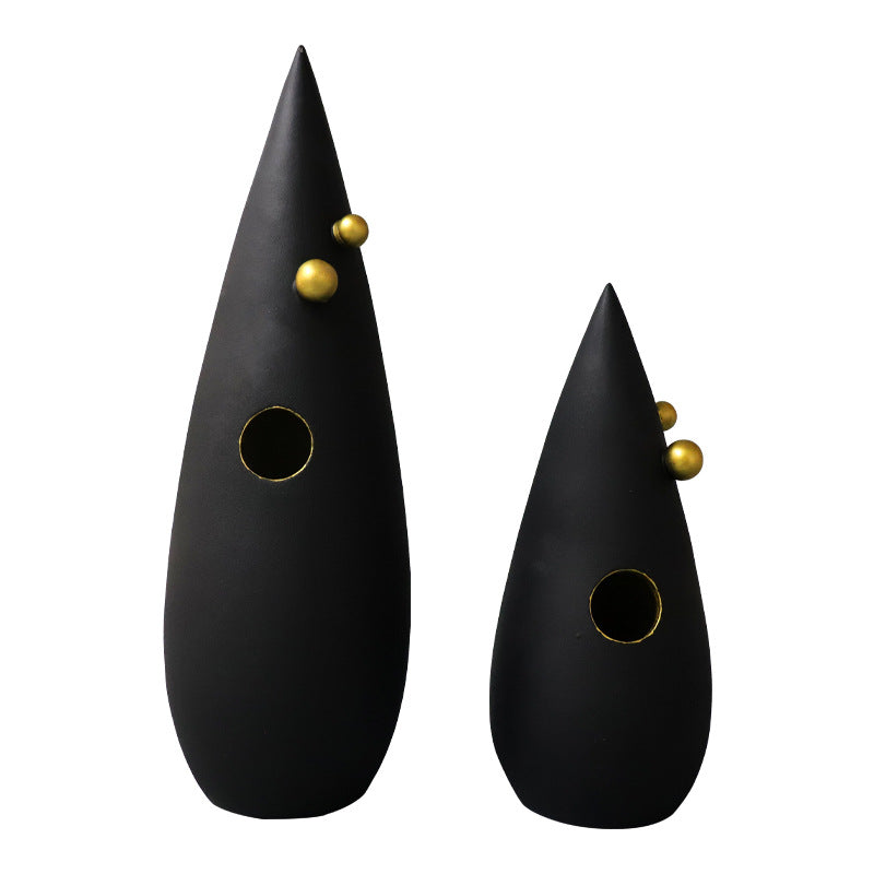 Abstract black decorative accent featuring gold details for contemporary home decor styling