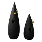 Abstract black decorative accent featuring gold details for contemporary home decor styling