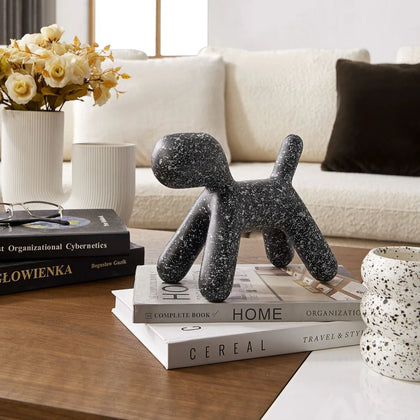 Contemporary black decorative dog accent featuring abstract balloon-inspired design for modern home interiors