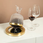 Modern whiskey serving decanter placed on a wooden coffee table in a sophisticated living room setup