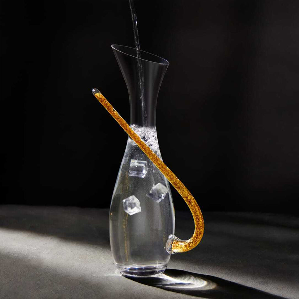 Elegant clear glass wine decanter featuring sculptural curved spout and modern handcrafted styling for premium dining experiences