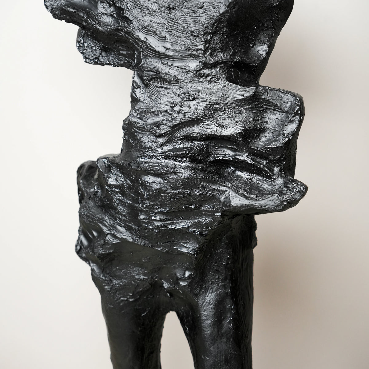 tall black sculpture human form living room statement piece
