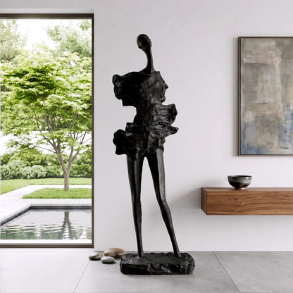 tall black sculpture human form living room statement piece