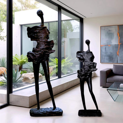 tall black sculpture human form living room statement piece