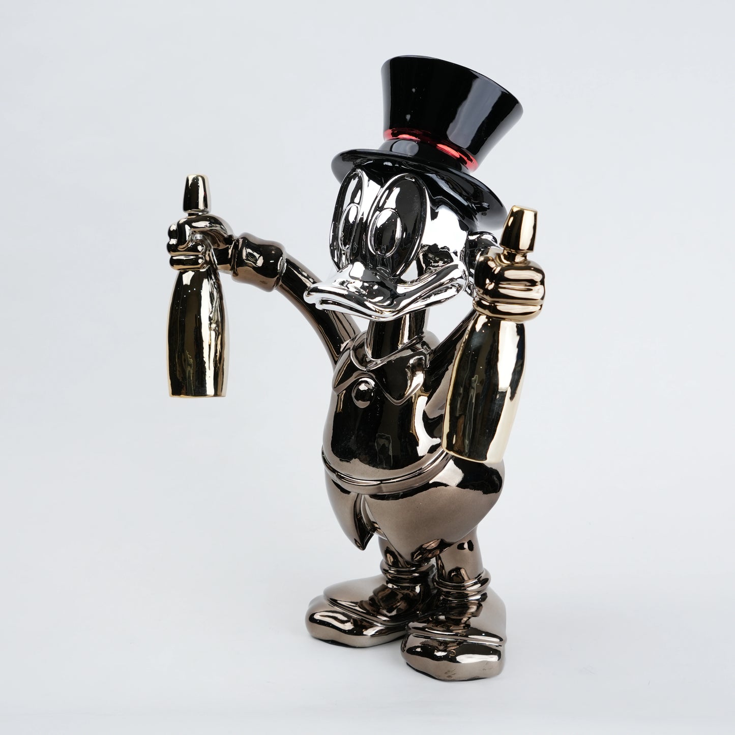 metallic duck figurine holding champagne bottles modern quirky home decor