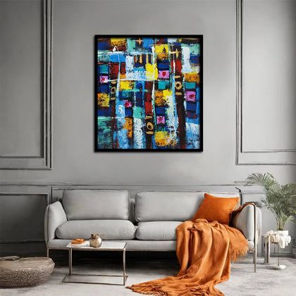 Abstract geometric canvas painting featuring vibrant blue, yellow, white, and multicolored textured blocks with modern artistic composition.