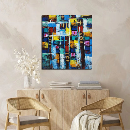 Abstract geometric canvas painting featuring vibrant blue, yellow, white, and multicolored textured blocks with modern artistic composition.