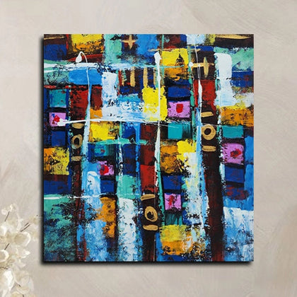 Abstract geometric canvas painting featuring vibrant blue, yellow, white, and multicolored textured blocks with modern artistic composition.