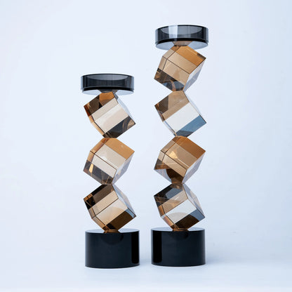 Geo Twist candle holder with faceted amber geometric design and black base