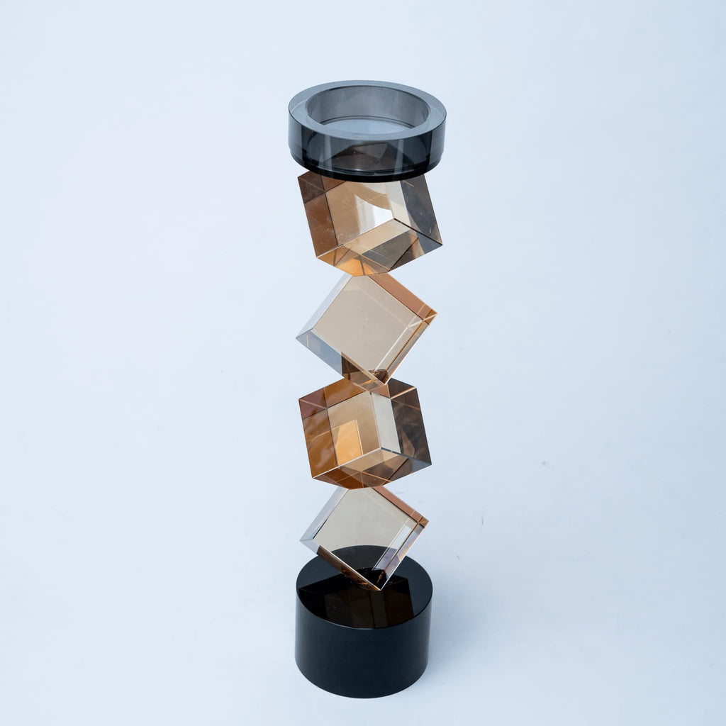 Contemporary twisted geometric candle holder in warm amber and black