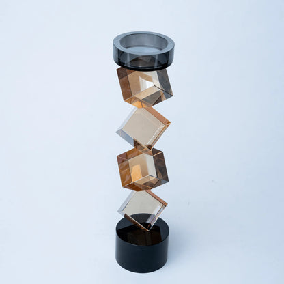 Contemporary twisted geometric candle holder in warm amber and black