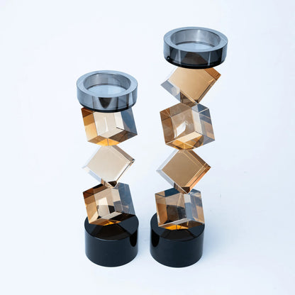 Faceted amber geometric candle stand with contrasting black cylindrical base