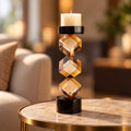 Contemporary twisted geometric candle holder in warm amber and black