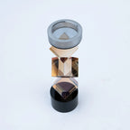 Luxury geometric candle stand with faceted amber-toned body