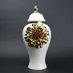 White ceramic decorative jar with gold laurel leaf band and lid