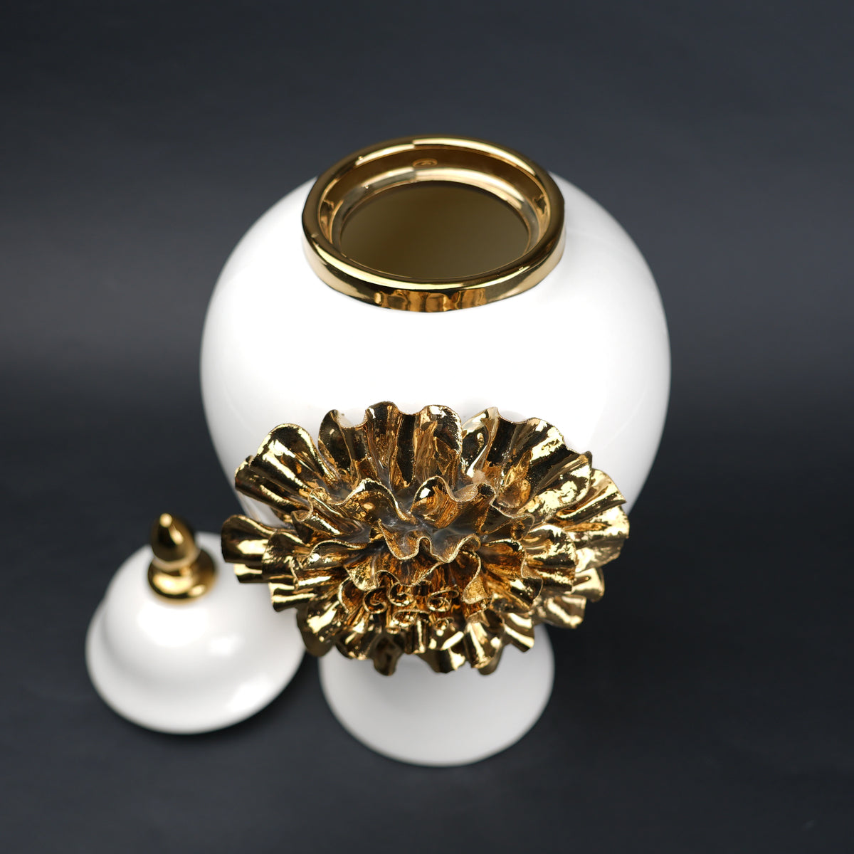 White ceramic decorative jar with gold laurel leaf band and lid
