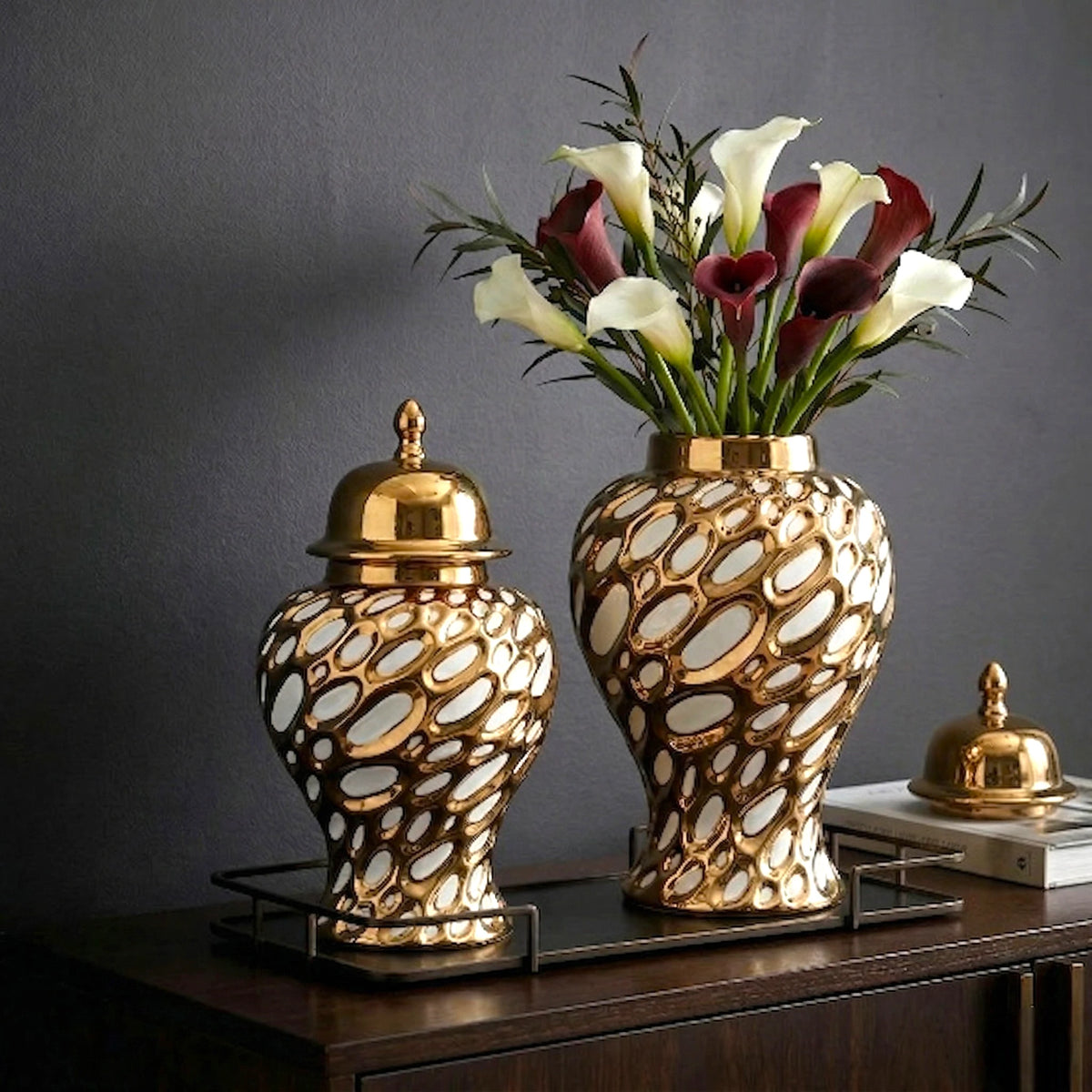 Gilded form jar pair w/ callas, dark wood