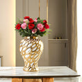 Large gilded form jar w/ roses on marble