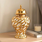 Small gilded form jar lidded on nightstand