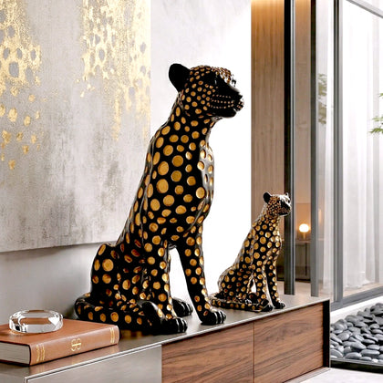Black leopard decor object with silver spots and gold detailing