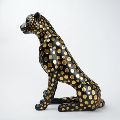 Black leopard decor object with silver spots and gold detailing