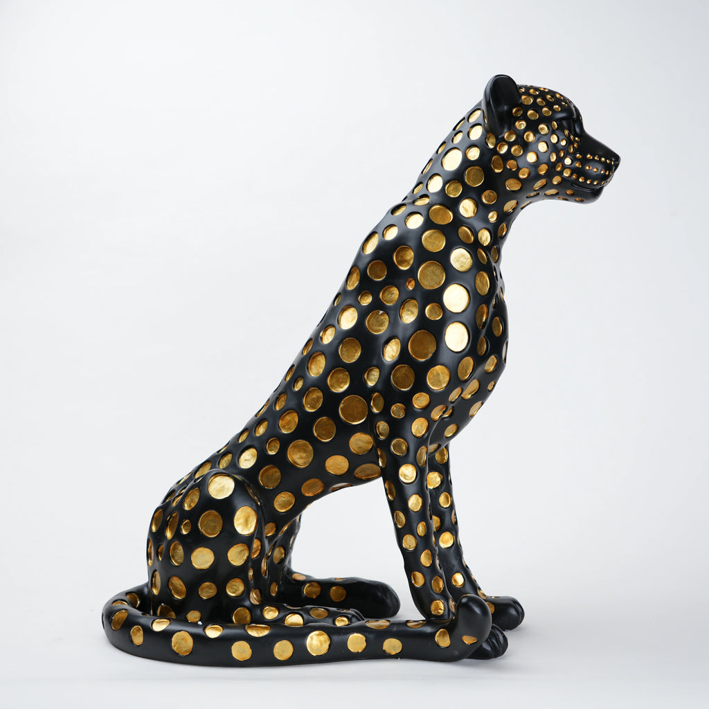 Black leopard decor object with silver spots and gold detailing
