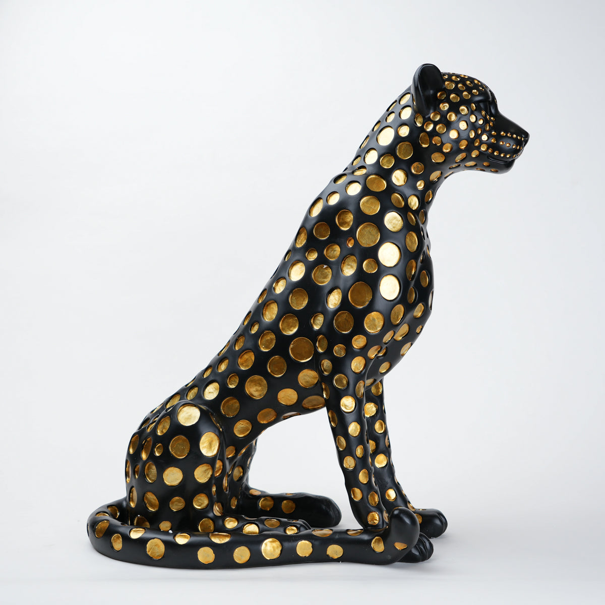 Black leopard decor object with silver spots and gold detailing
