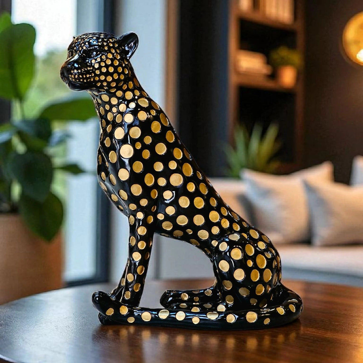 Black leopard decor object with silver spots and gold detailing